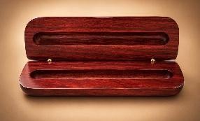 Open rosewood single-groove pen and pencil case on a warm tan background