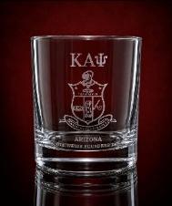 Rocks glass etched with a Kappa Alpha Psi crest and chapter text on a deep red backdrop
