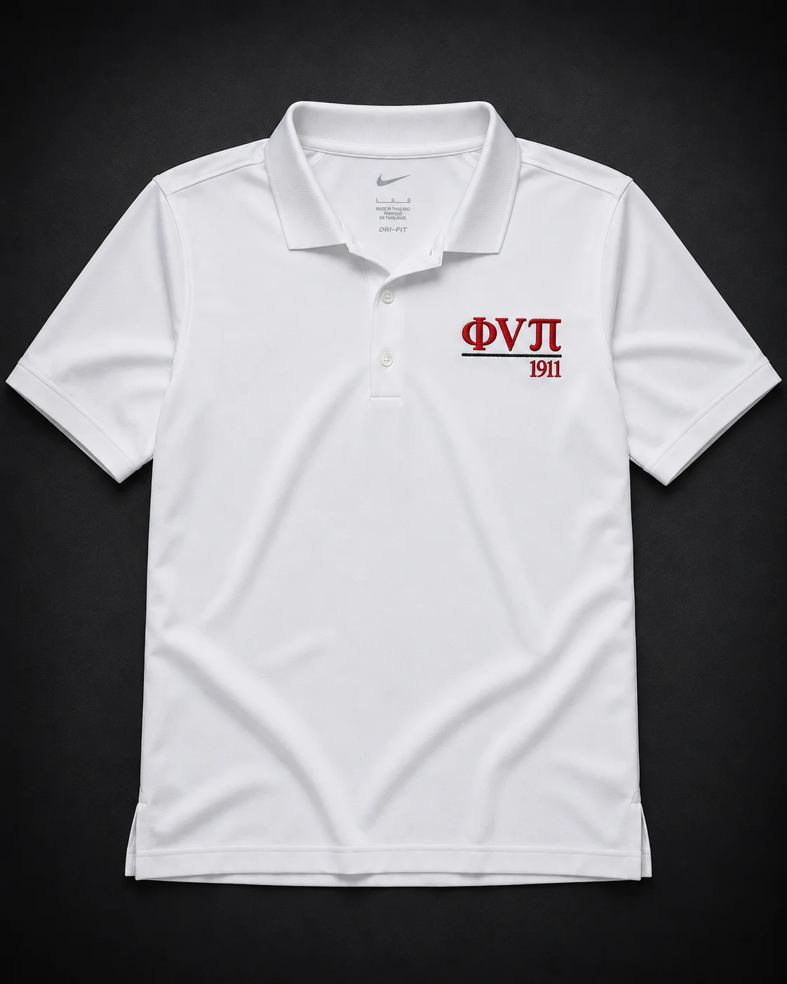 Custom embroidered white Nike Dri-FIT performance polo with crimson Greek letter abbreviation, rule line, and founding year on left chest.
